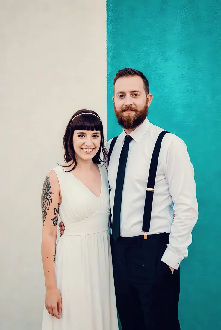 Fun loving couple outside town landmark at a Stourport wedding