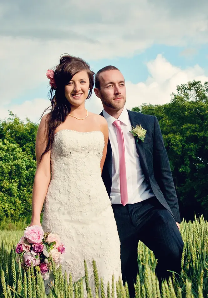 Newlyweds quiet time through a meadow in Bewdley